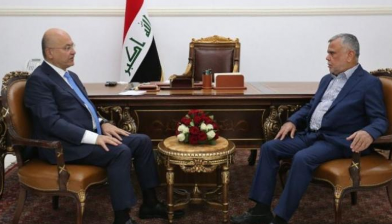 الرئيس العراقي برهم صالح والقيادي في تحالف البناء هادي العامري