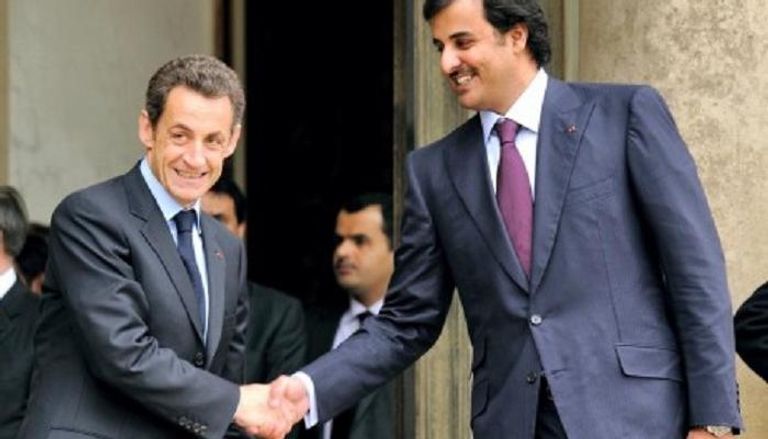 الرئيس الفرنسي الأسبق نيكولا ساركوزي وأمير قطر تميم- صورة أرشيفية