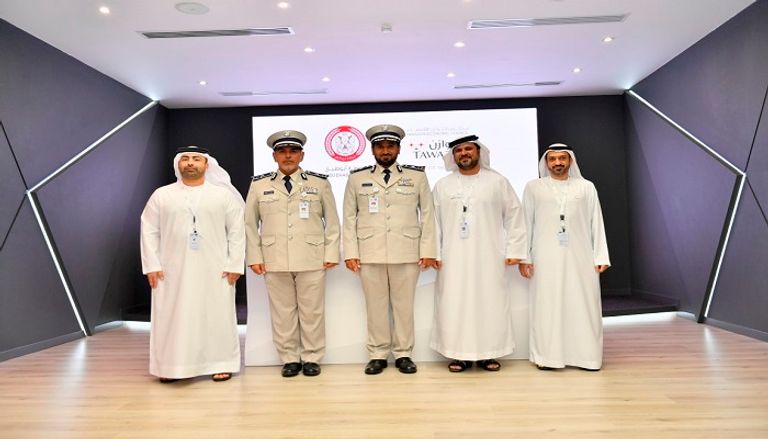 جانب من توقيع اتفاقية بين شرطة أبوظبي و
