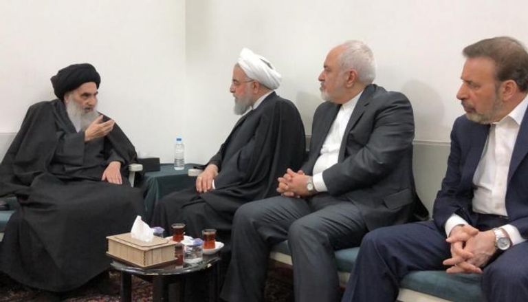 روحاني خلال لقاءه علي السيستاني بالنجف