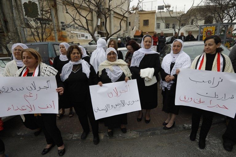 أهالي الجولان يتظاهرون ضد قرار ترامب - رويترز