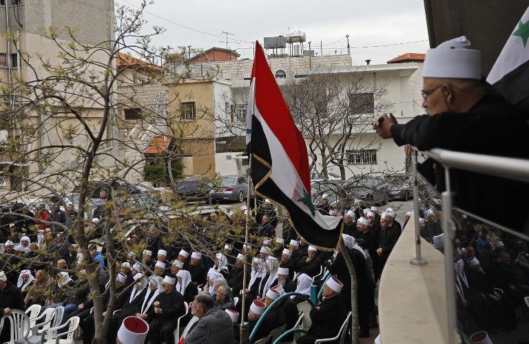 أهالي الجولان يتظاهرون ضد قرار ترامب - رويترز