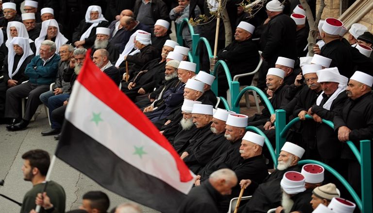 أهالي الجولان يتظاهرون ضد قرار ترامب - رويترز