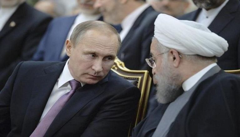 الرئيسان الروسي فلاديمير بوتين والإيراني حسن روحاني - رويترز
