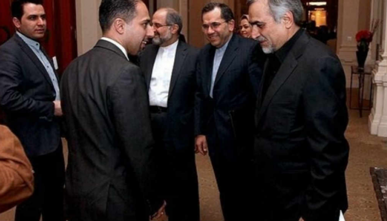الرئيس السابق للوبي ناياك بجانب شقيق الرئيس الإيراني - أرشيفية