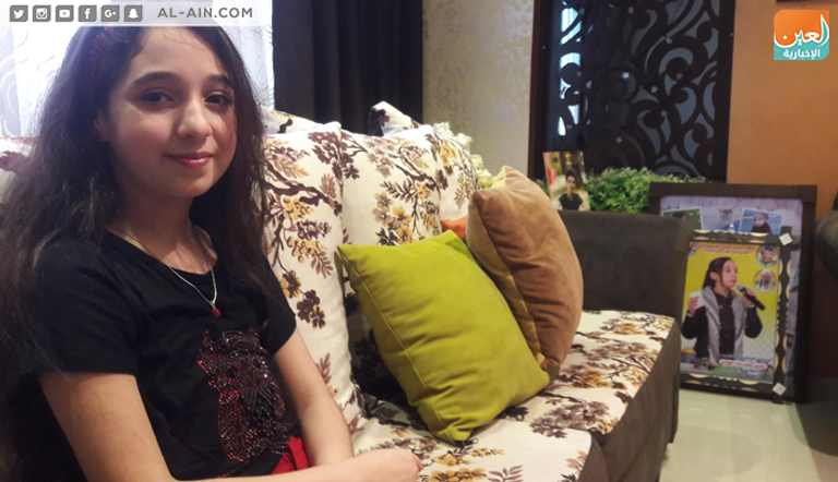 ميس عبدالهادي لدى تكريمها في مهرجان الشعر بتونس