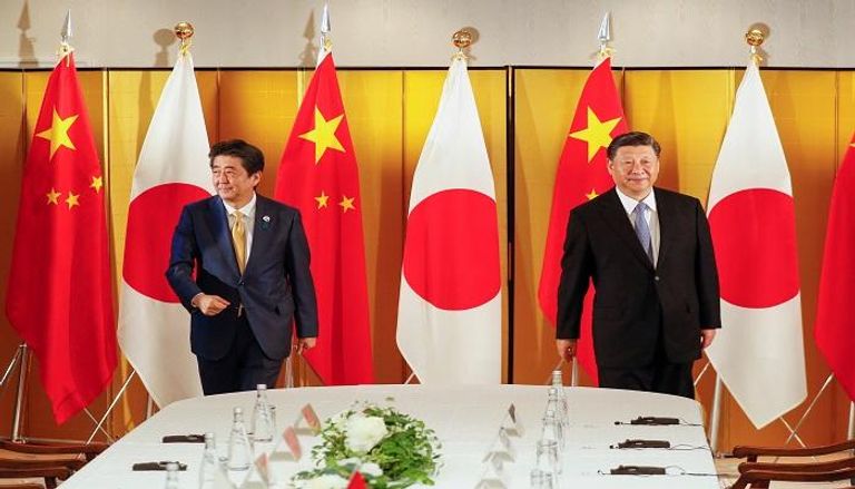 شي جين بينغ ورئيس الوزراء الياباني- رويترز