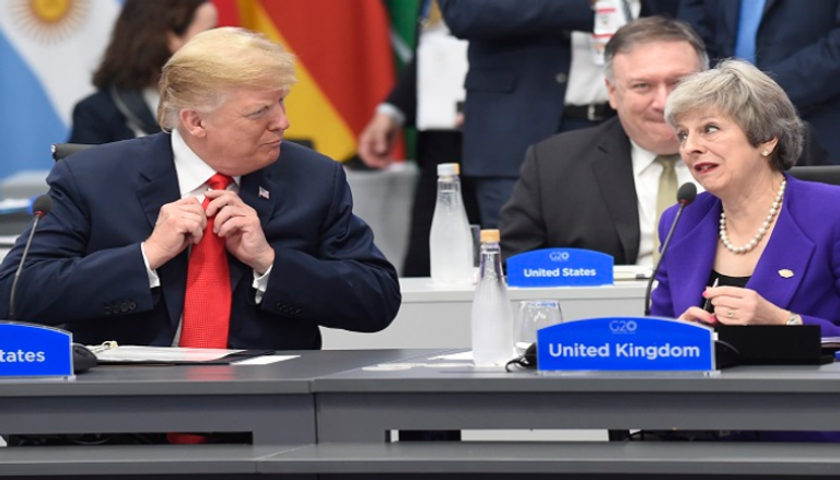  الرئيس الأمريكي ورئيسة الوزراء البريطانية خلال قمة العشرين 