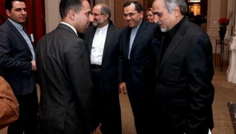 ترتيا بارسا الرئيس السابق للوبي بجانب شقيق الرئيس الإيراني - أرشيفية