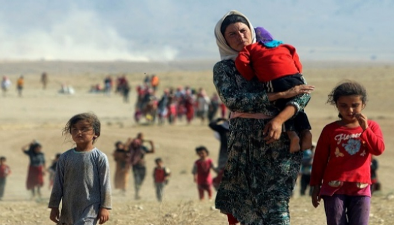 صورة أرشيفية لنازحين من الإيزيديين في العراق (رويترز)