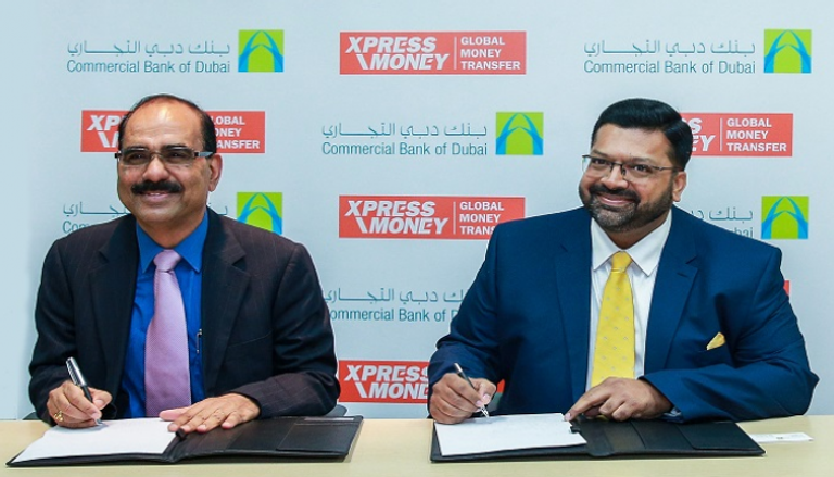 توقيع الاتفاقية بين دبي التجاري وشركة إكسبرس
