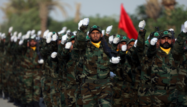 عناصر تابعة لمليشيا الحشد الشعبي بالعراق