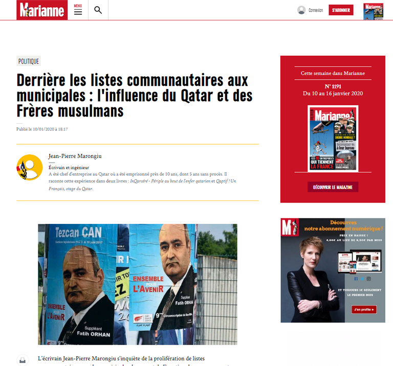 شاب فرنسي أمام لافتات دعائية لانتخابات البلدية 