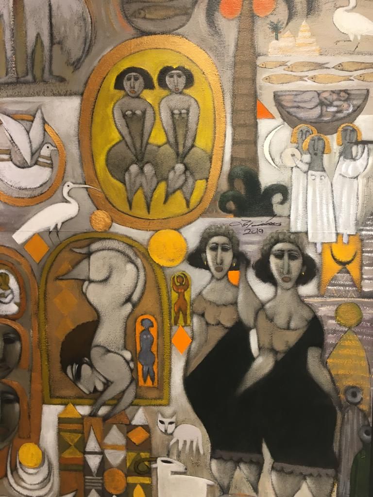 مصطفى رحمة بجوار إحدى لوحاته