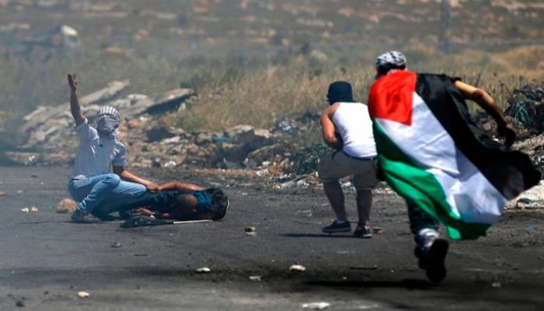 إصابة أحد الفلسطينيين في مواجهات مع الاحتلال- أرشيفية
