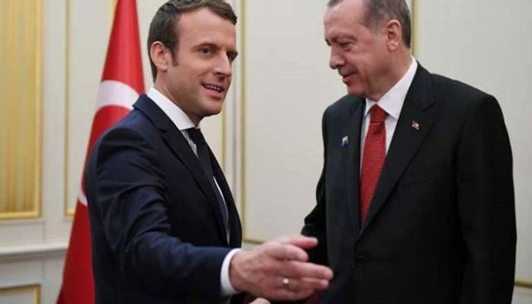 الرئيسان التركي والغرنسي خلال لقاء سابق