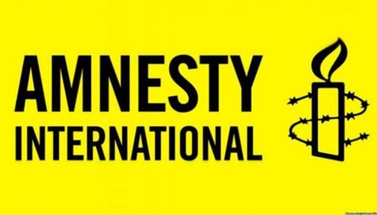 شعار منظمة العفو الدولية- أرشيفية