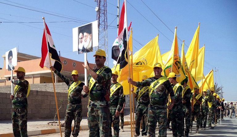 إحدى المليشيات الإيرانية في العراق- أرشيفية متظاهرون في بغداد يطالبون بمحاربة الفساد - أرشيفية