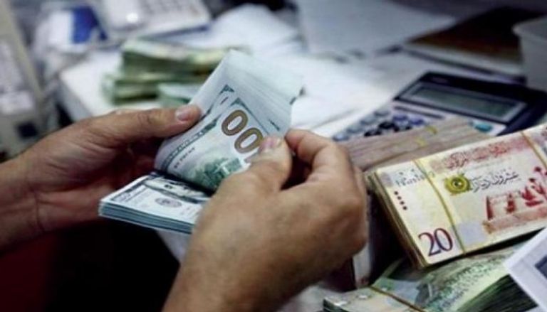 توحيد سعر الدينار الليبي أمام الدولار