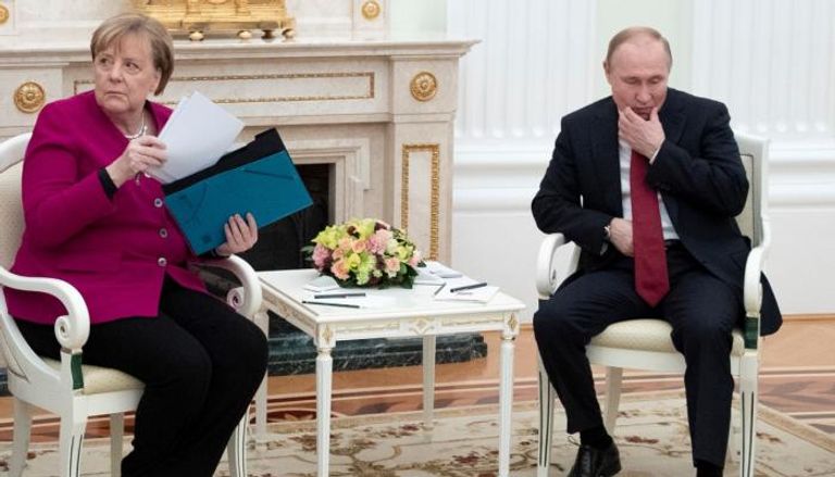 بوتين وميركل 
