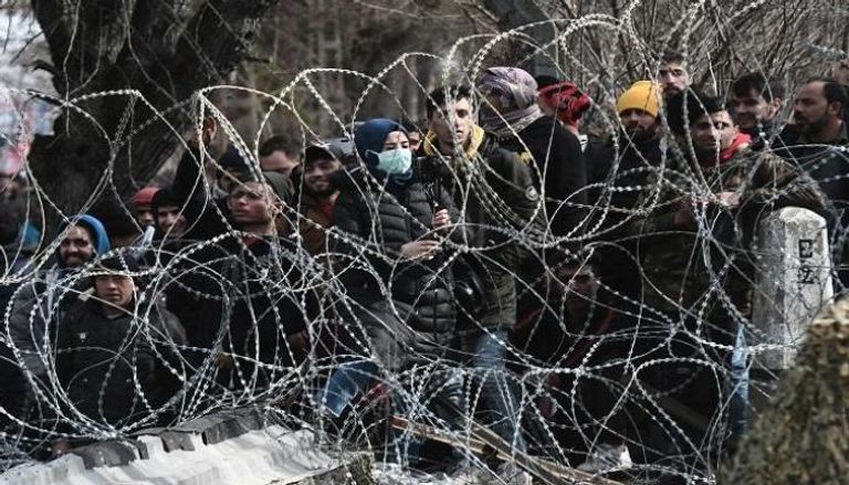 لاجئون سوريون على حدود اليونان- أ.ف.ب