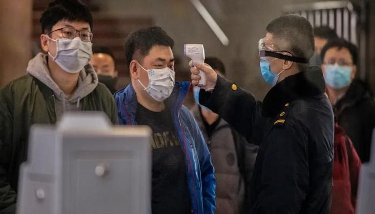 إجراءات الكشف عن مصابين بكورونا في الصين