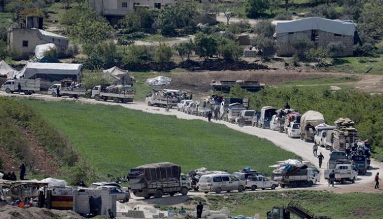 نازحون سوريون إلى إدلب - رويترز 