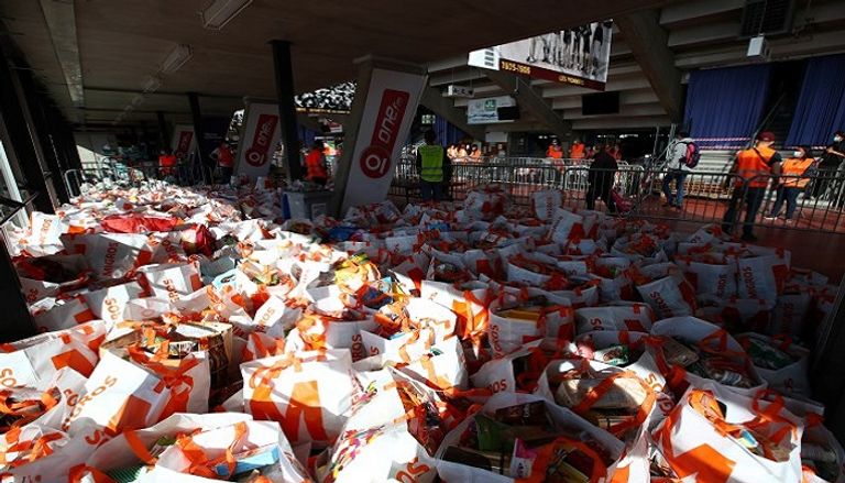 صفوف طويلة في جنيف للحصول على الطعام المجاني