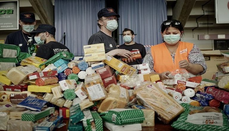 صفوف طويلة في جنيف للحصول على الطعام المجاني