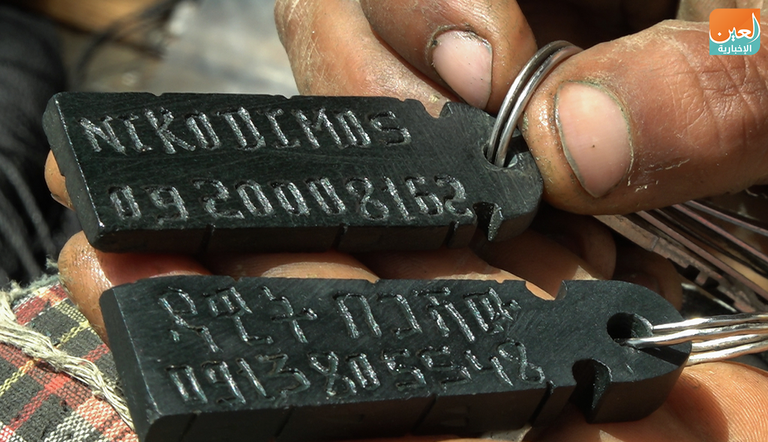 نيقوديموس برهاني بجوار بعض أعماله