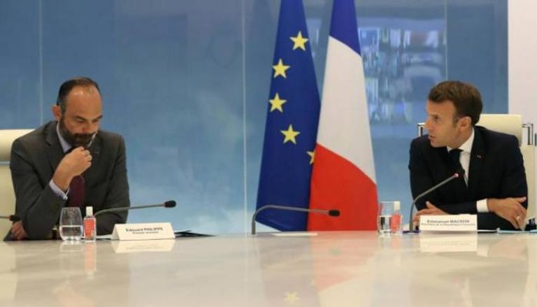 الرئيس الفرنسي إيمانويل ماكرون ورئيس وزرائه إدوارد فيليب