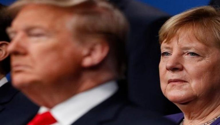 المستشارة الألمانية أنجيلا ميركل والرئيس الأمريكي دونالد ترامب - أ.ف.ب