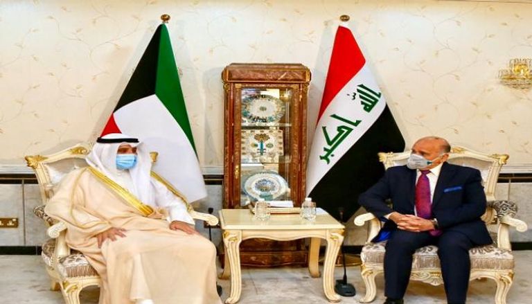 وزير الخارجية الكويتي ونظيره العراقي خلال اللقاء 