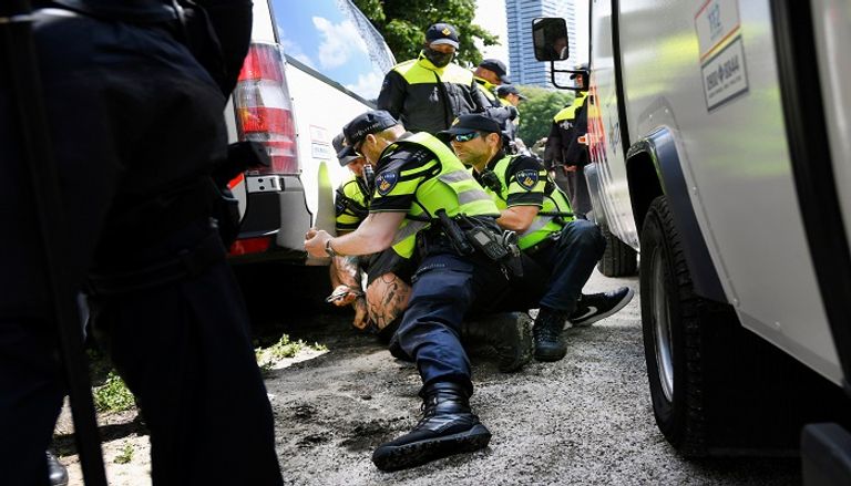 جانب من الاحتجاجات - أ.ف.ب جانب من الاحتجاجات - أ.ف.ب