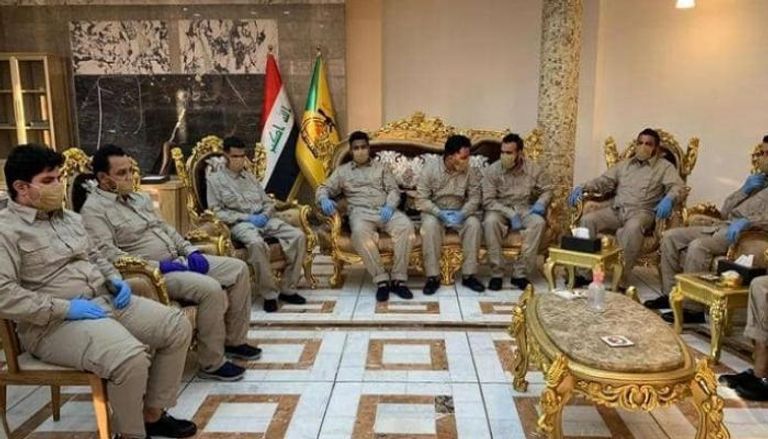 صورة متداولة لأعضاء حزب الله العراقي بعد الإفراج عنهم