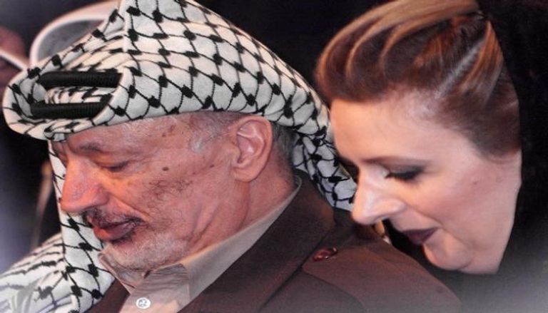 الرئيس الفلسطيني الراحل ياسر عرفات وزوجته - أ.ف.ب