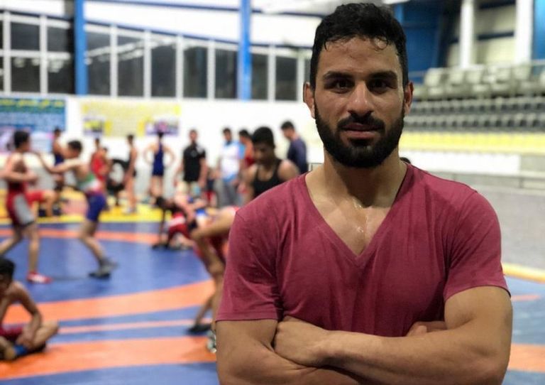 ملصقات تقدم التعازي لعائلة نويد أفكاري - أرشيفية