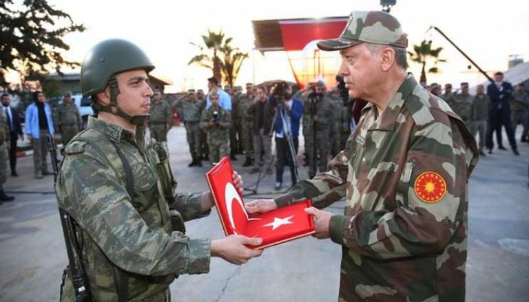 أردوغان بالزي العسكري في هاتاي الحدوية مع سوريا - أرشيفية أردوغان يستخدم الطائرات المسيرة للعدوان على سوريا وليبيا