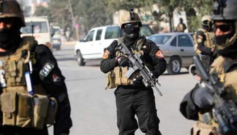 عناصر من الشرطة العراقية في مهمة أمنية ببغداد - إرشيفية