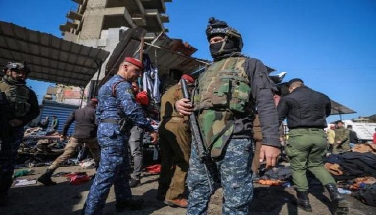 عناصر أمن تنتشر في موقع التفجيرات ببغداد