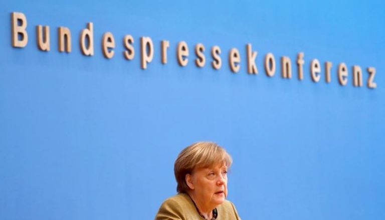 المستشارة الألمانية أنجيلا ميركل خلال مؤتمر صحفي ببرلين- رويترز
