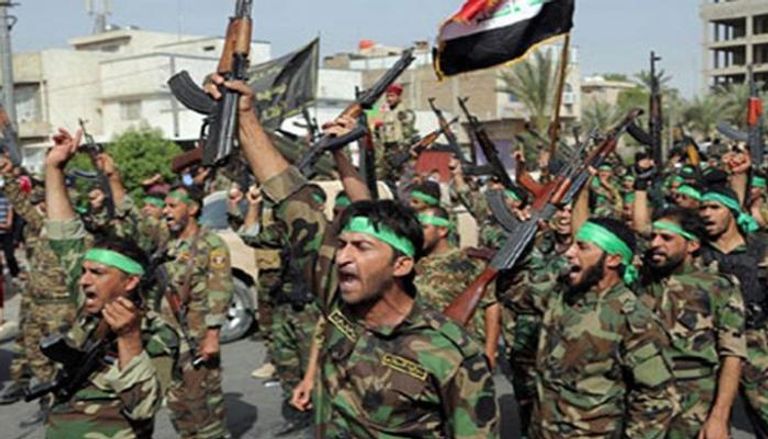 عناصر من مليشيات الحشد خلال استعراض عسكري في بغداد