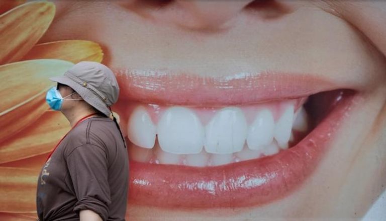 الاعتناء بصحة الفم يقلل حدة أعراض كورونا- أرشيفية