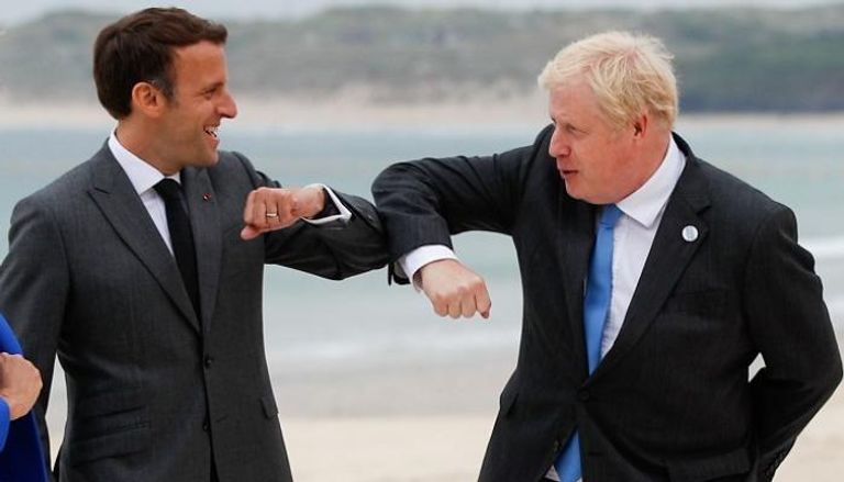 الرئيس الفرنسي ورئيس الوزراء البريطاني خلال لقاء سابق- رويترز