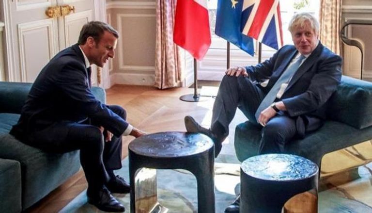 رئيس الوزراء البريطاني بوريس جونسون والرئيس الفرنسي إيمانويل ماكرون