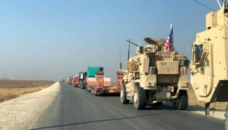 عربات عسكرية ترافق شاحنات أمريكية بسوريا- أرشيفية
