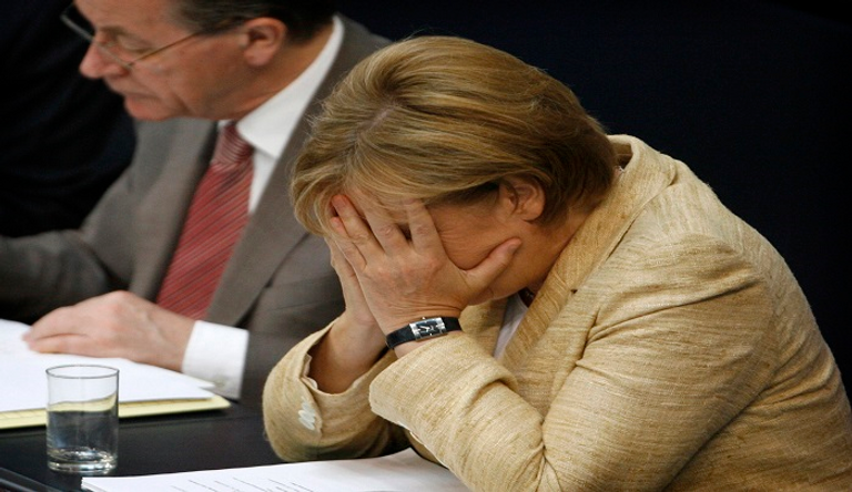 نظرة حادة من ميركل لبوش تعود للعام 2007 - رويترز