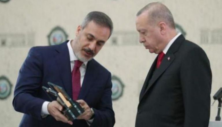 أردوغان مع هاكان فيدان رئيس الاستخبارات التركية