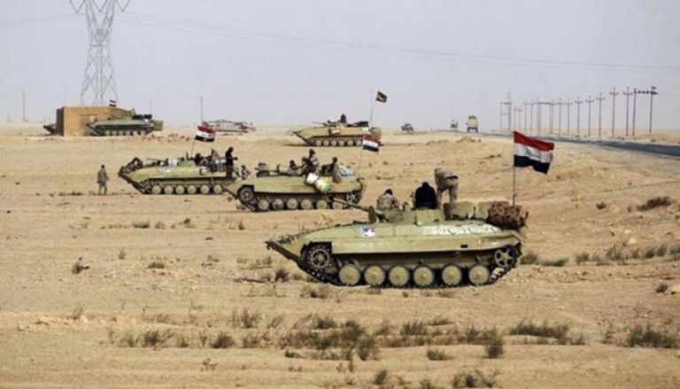 قوة من الجيش العراقي قرب الحدود السورية 