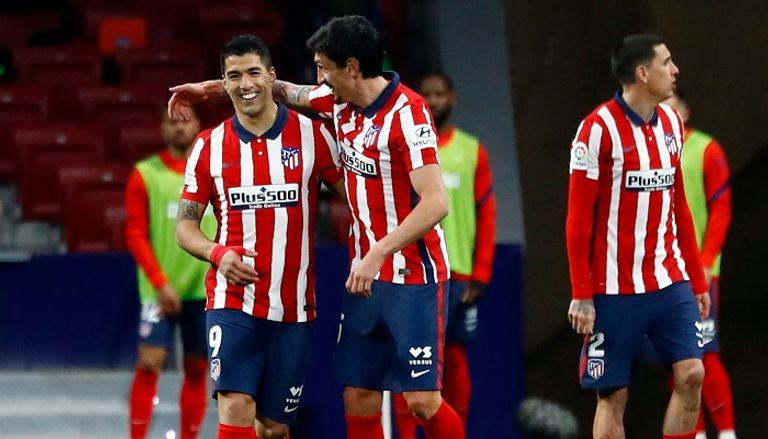 لويس سواريز مهاجم أتلتيكو مدريد ليونيل ميسي قائد برشلونة